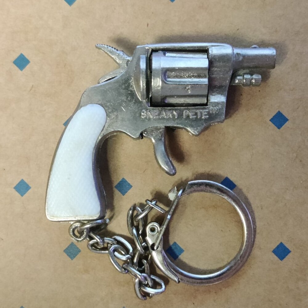 Vintage SNEAKY PETE CAP PISTOL Miniature Die-cast Metal Cap Gun-KEYCHAIN